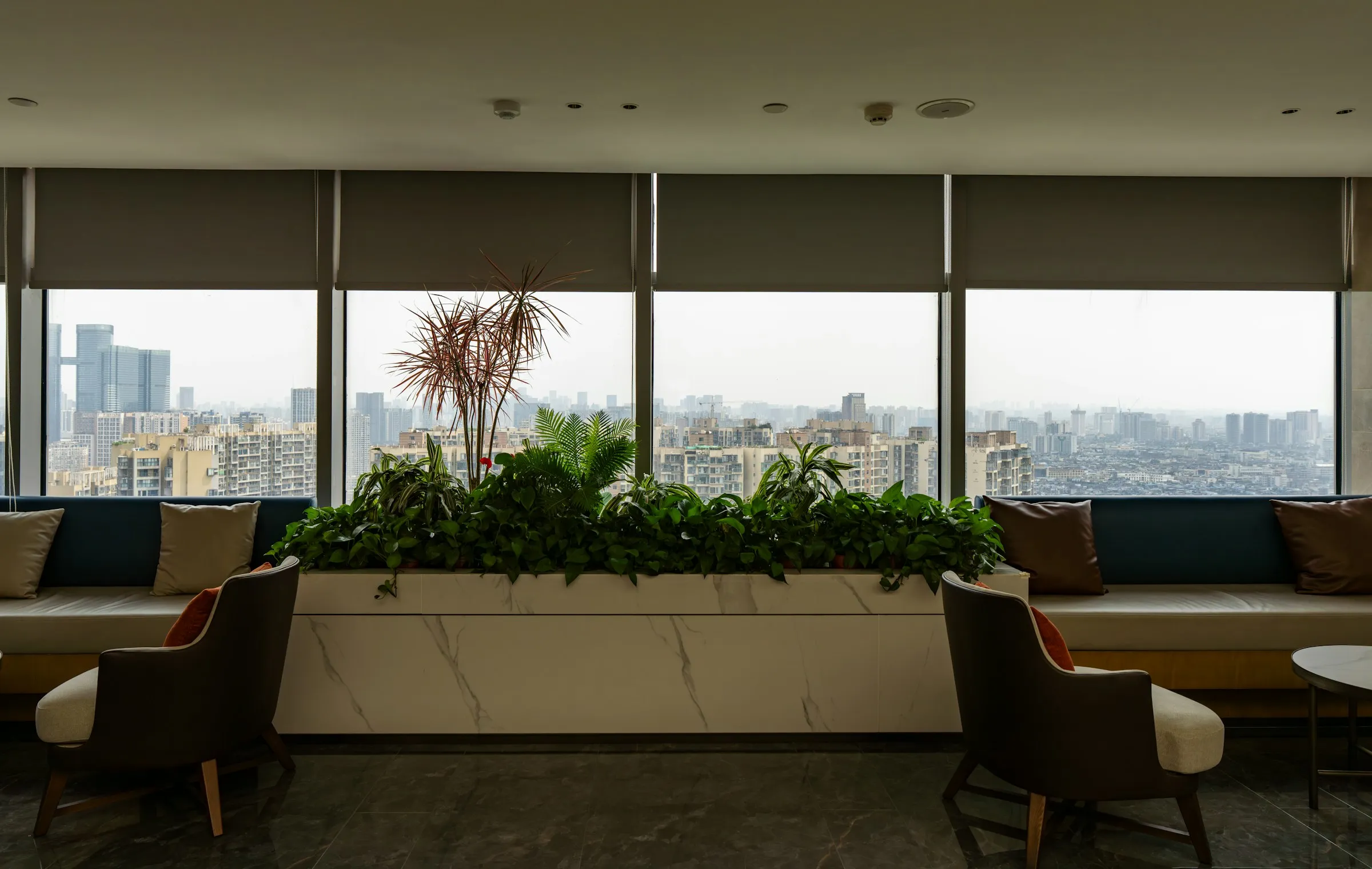 Multi-family residential corridor with patterned broadloom carpet running between guarded suite doors.